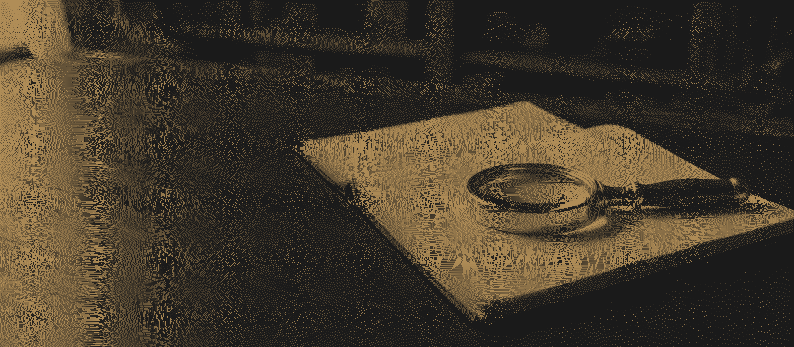 A brass magnifying glass on an open ledger, printed in gold dots on black